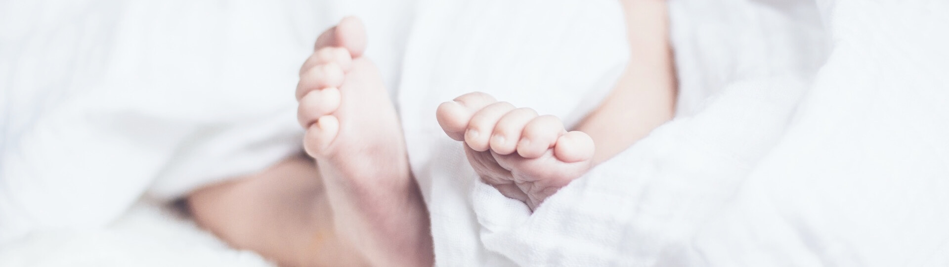 Baby feet poking out of blanket