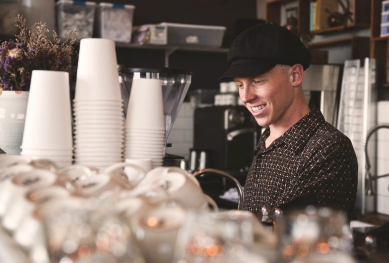 Barista man making a coffee