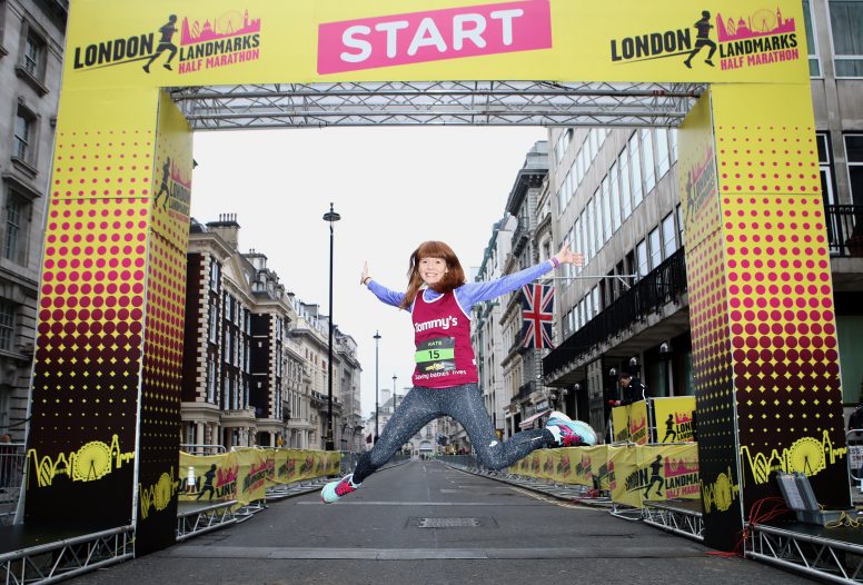 Girl jumping at the start of the London Landmarks Half Marathon