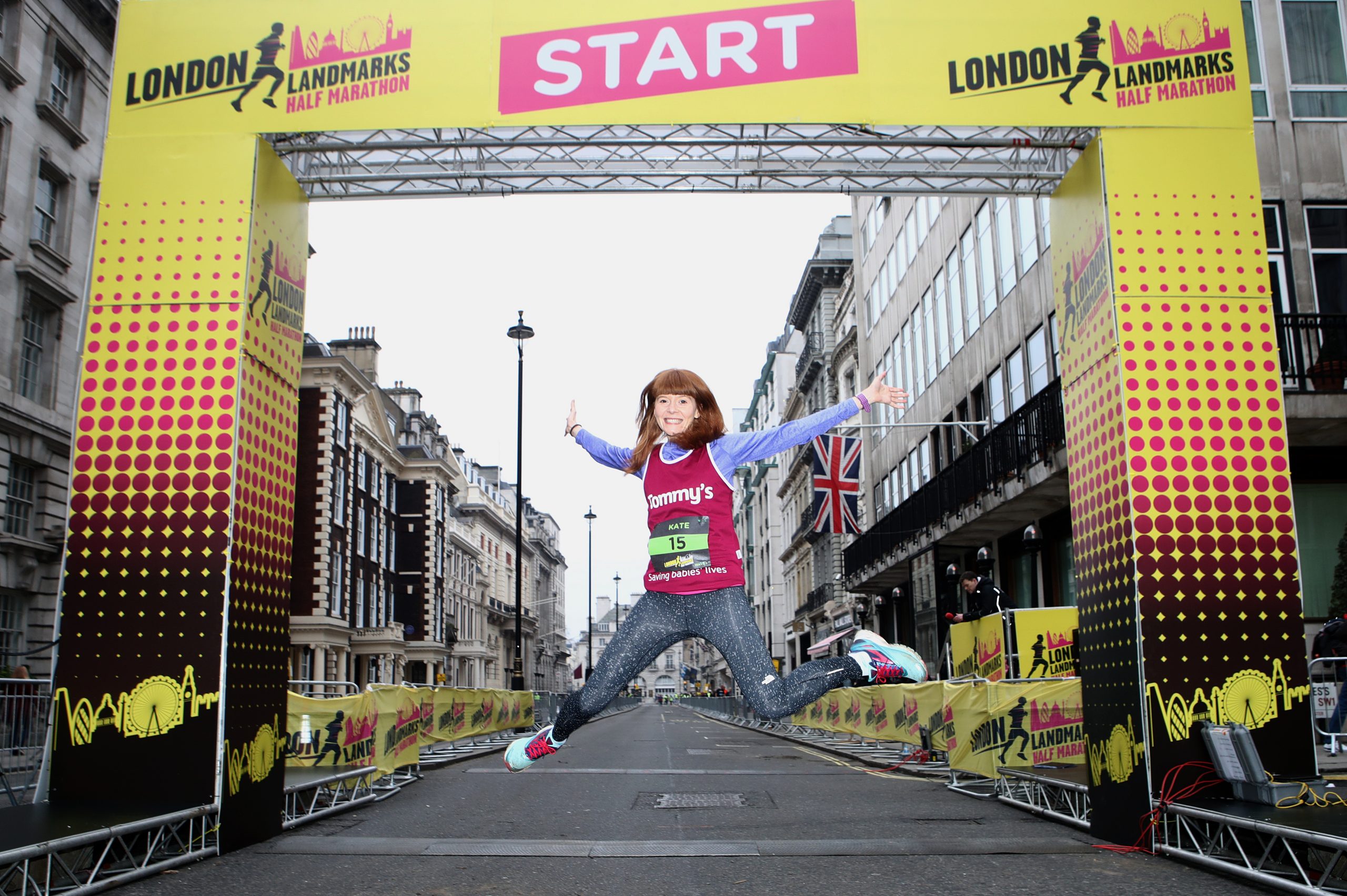 Girl jumping at the start of the London Landmarks Half Marathon