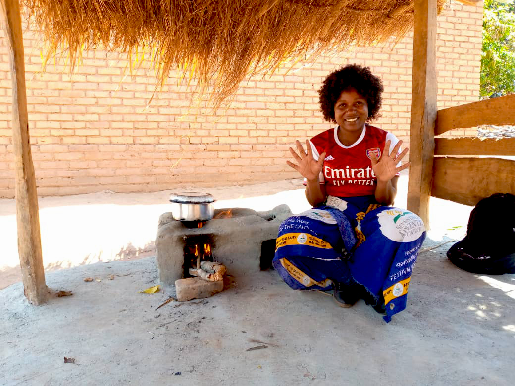 Dorah sat using her cookstove