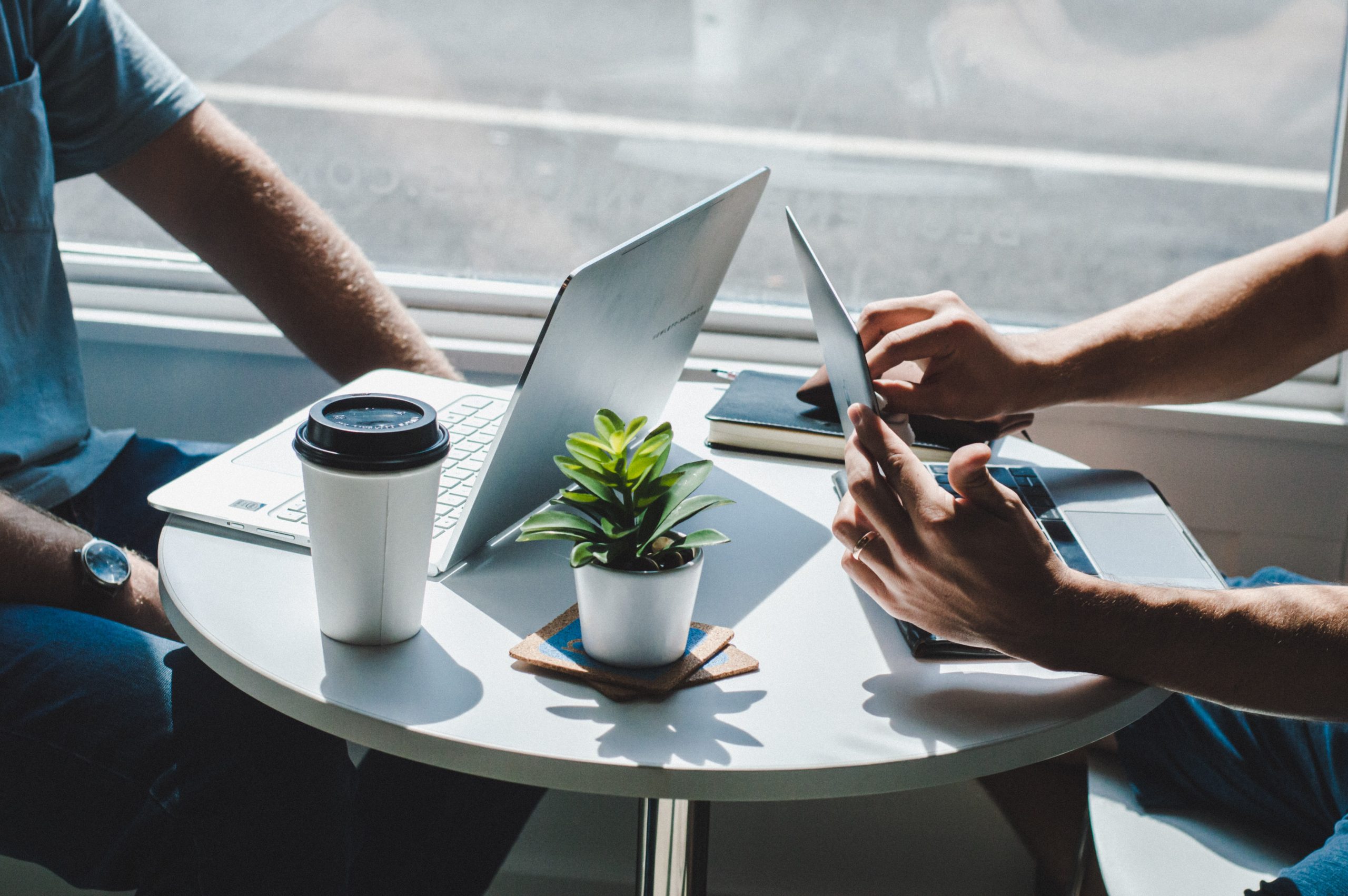 Two people in conversation over a coffee